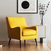 Poltrona giallo senape con gambe nere